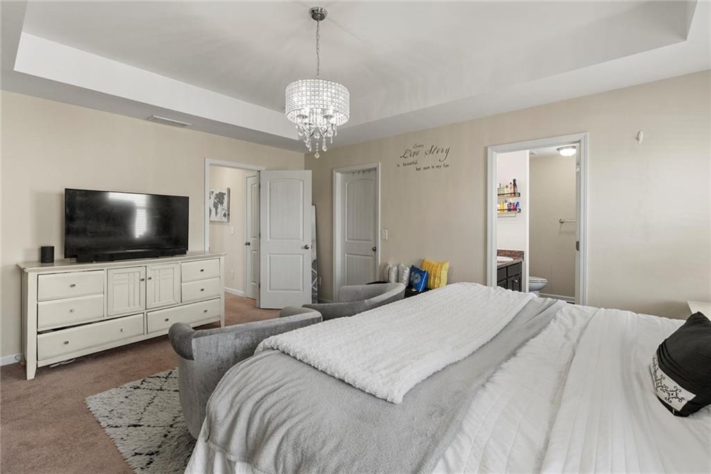 62 Timberland Trace Way Dallas, GA 30157 - Photo 16 of 27 a bedroom with a bed and a flat screen tv