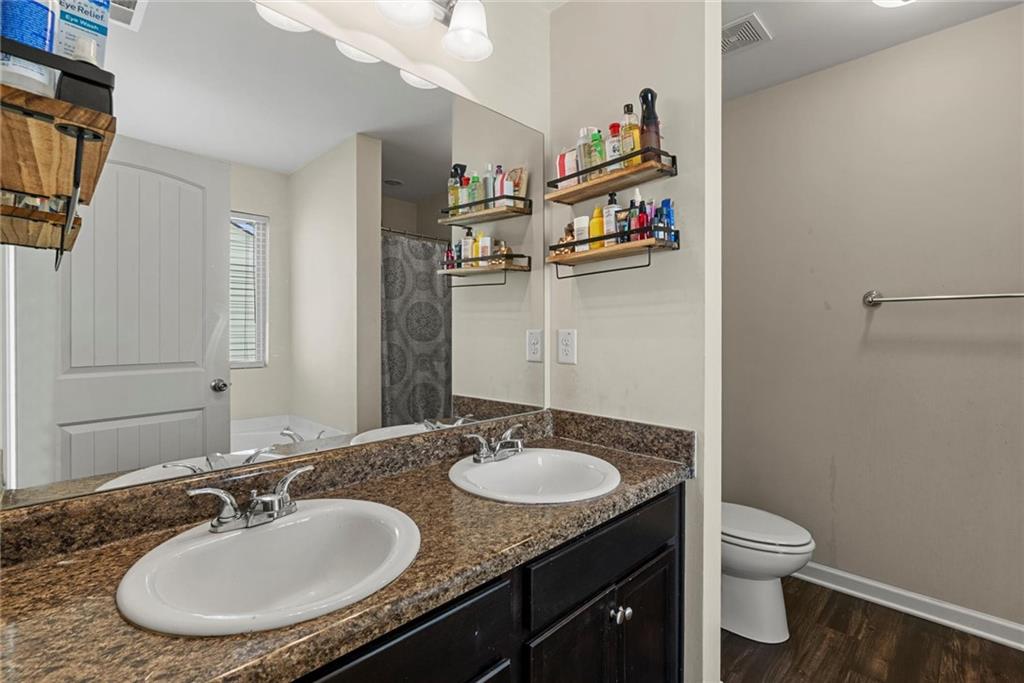 62 Timberland Trace Way Dallas, GA 30157 - Photo 17 of 27 a bathroom with a granite countertop sink and a mirror