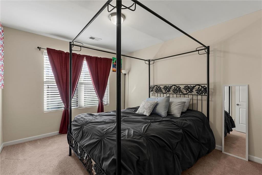 62 Timberland Trace Way Dallas, GA 30157 - Photo 20 of 27 a bedroom with a bed and a window