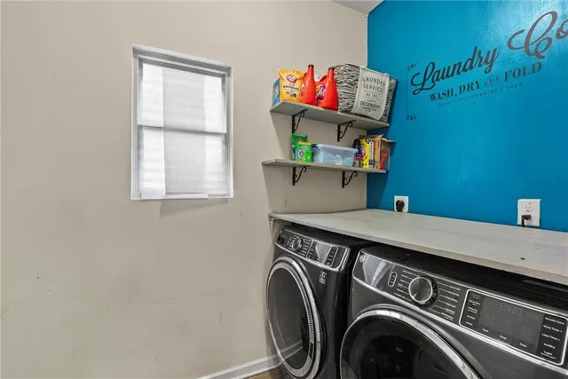 a utility room with dryer and washer