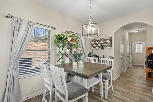 a view of a dining room with furniture window and wooden floor
