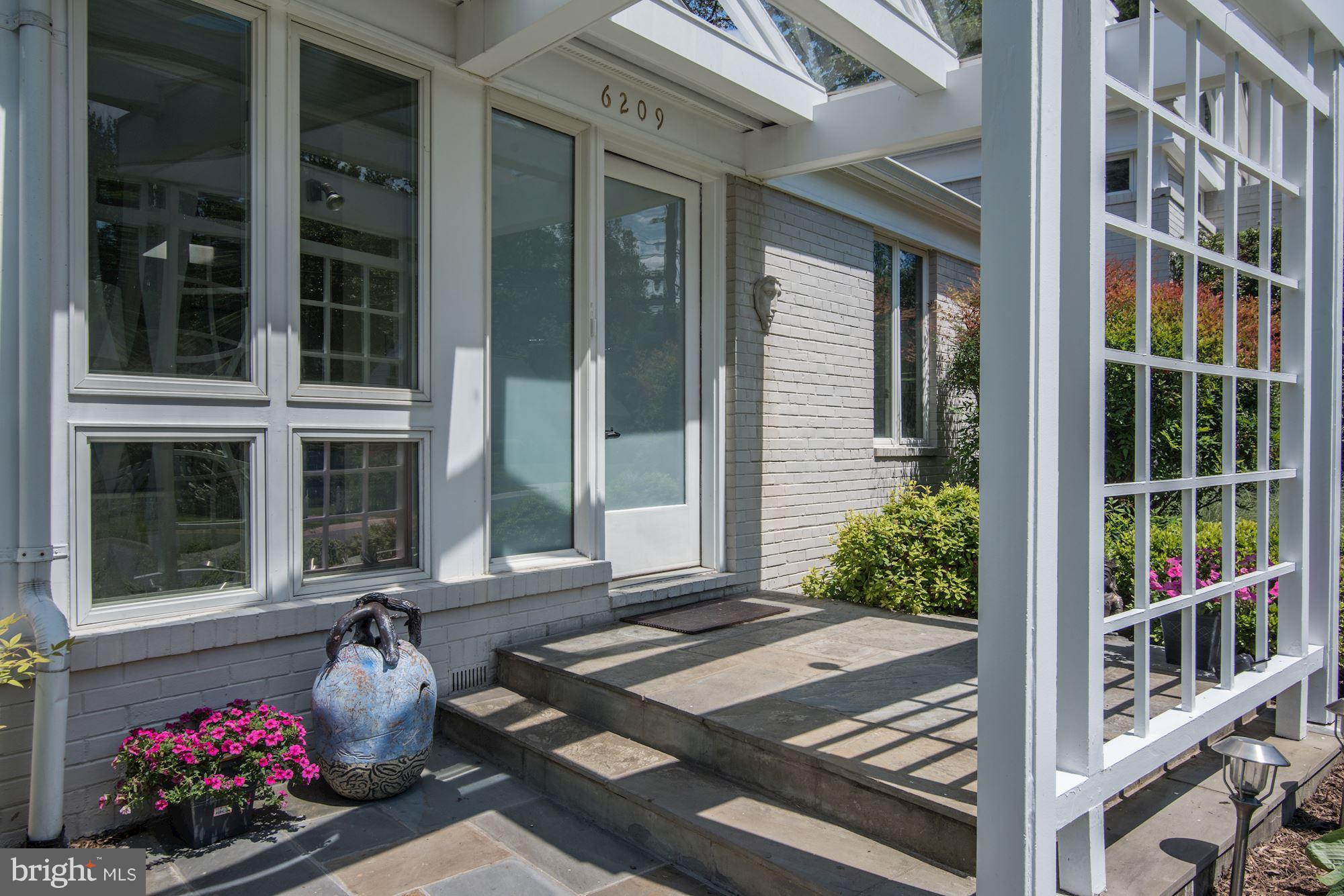 6209 Valley Road Bethesda, MD 20817 - Photo 3 of 30 a front view of a house with outdoor seating