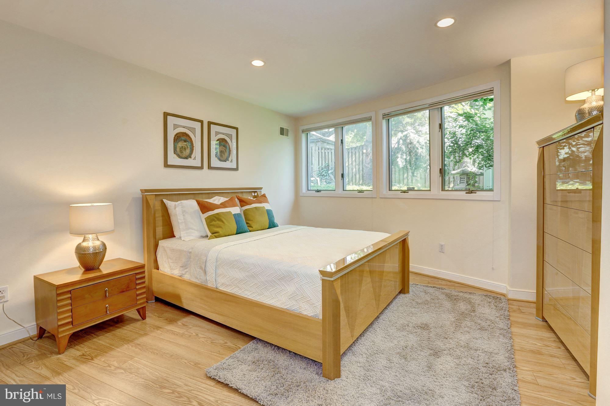 6209 Valley Road Bethesda, MD 20817 - Photo 22 of 30 a bedroom with a bed and wooden floor