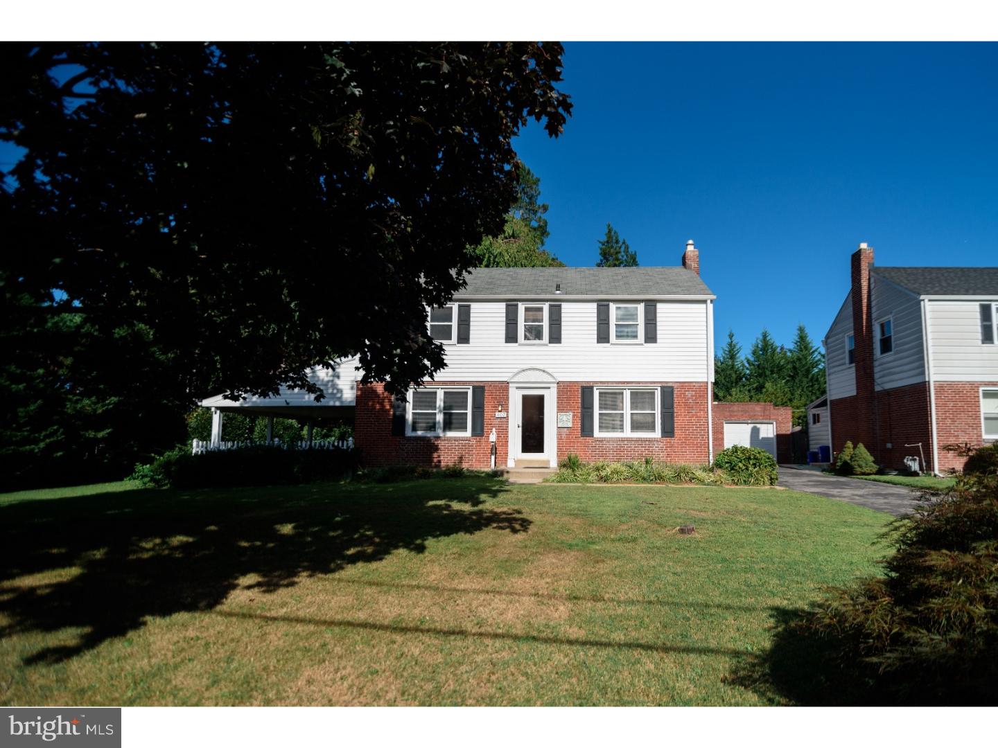 402 Devon Road Havertown, PA 19083 - Photo 1 of 19 a front view of a house with a garden