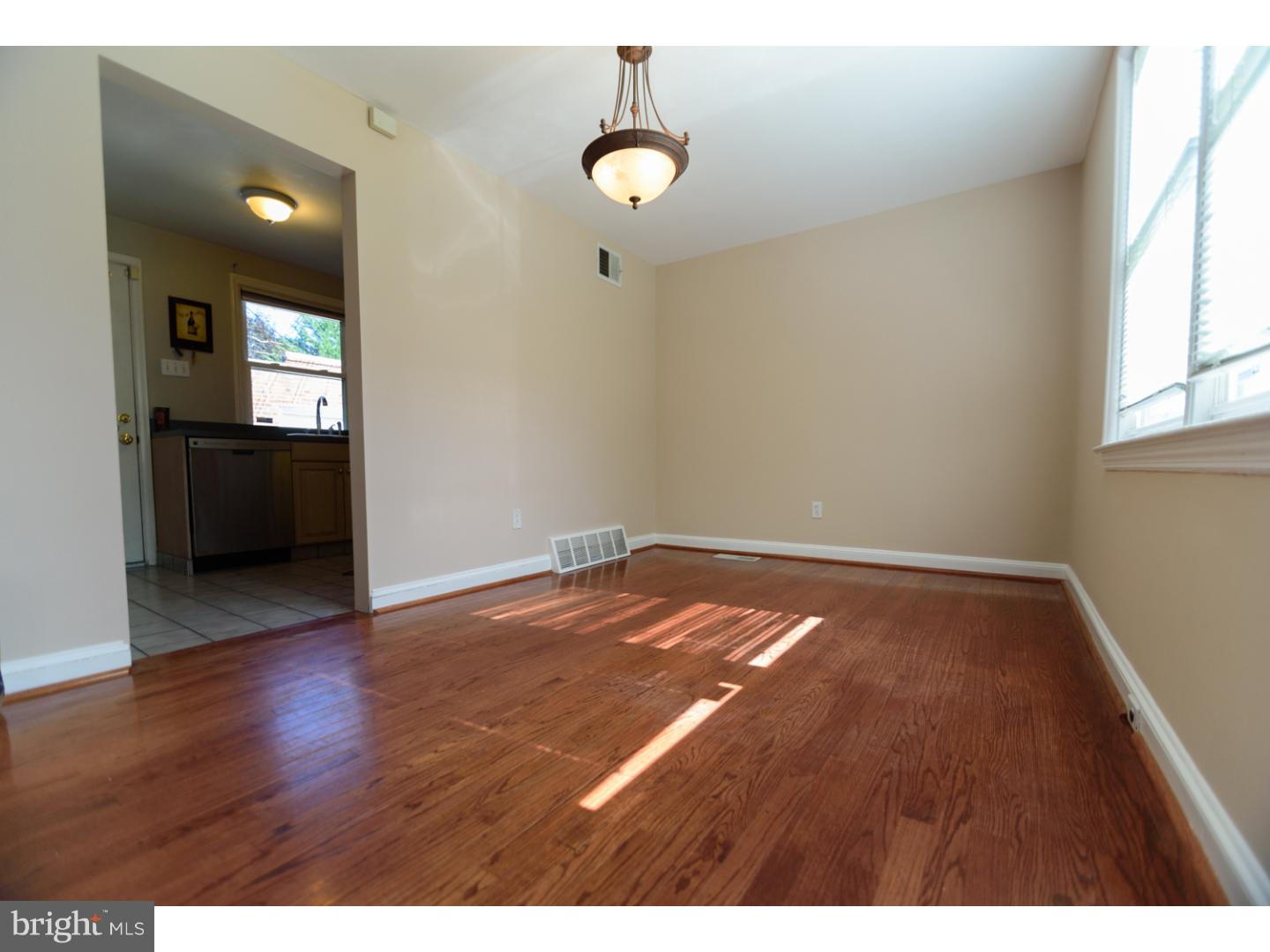 402 Devon Road Havertown, PA 19083 - Photo 5 of 19 a view of a room with wooden floor and window