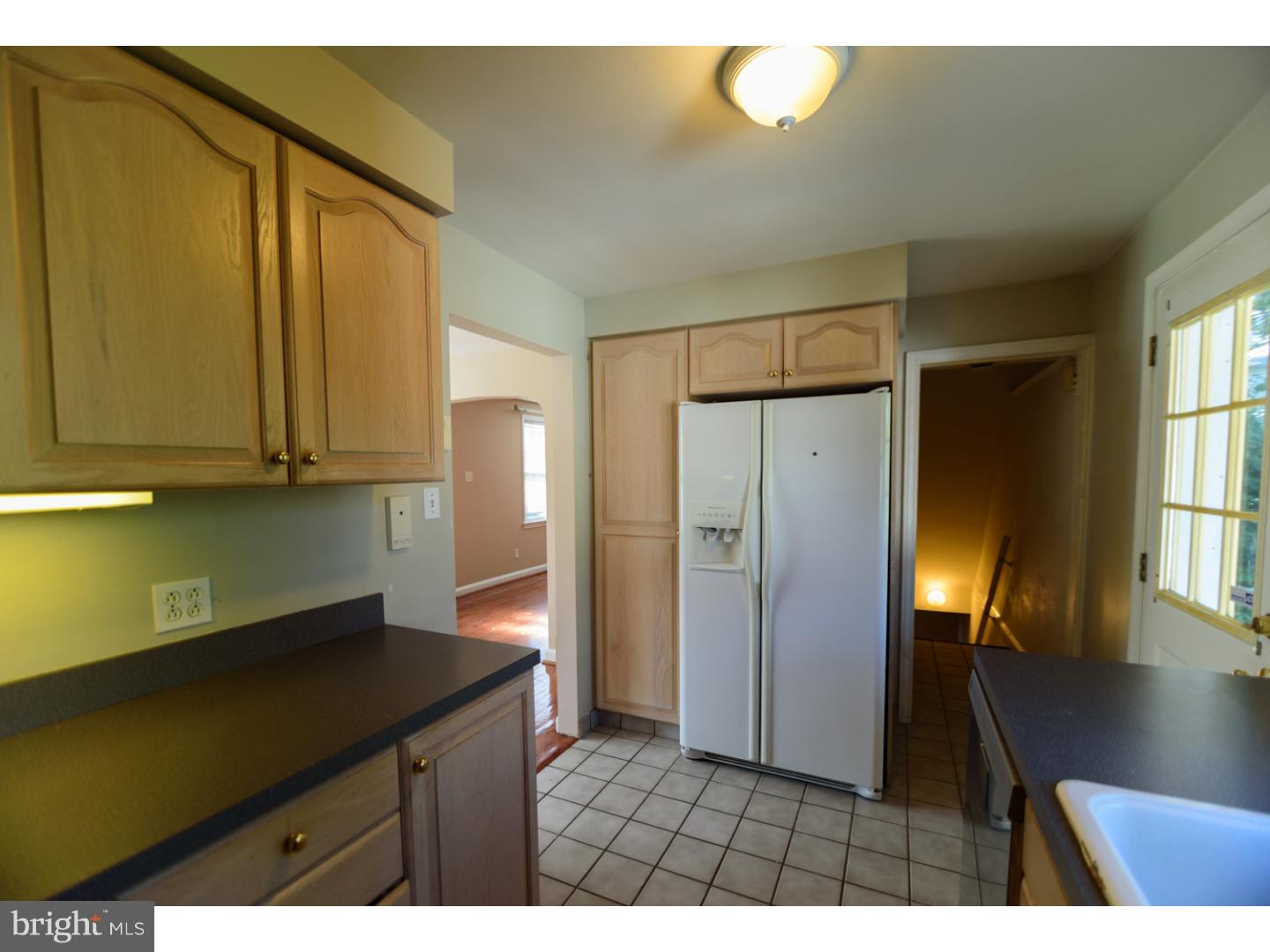 402 Devon Road Havertown, PA 19083 - Photo 7 of 19 a view of kitchen with cabinets and wooden floor