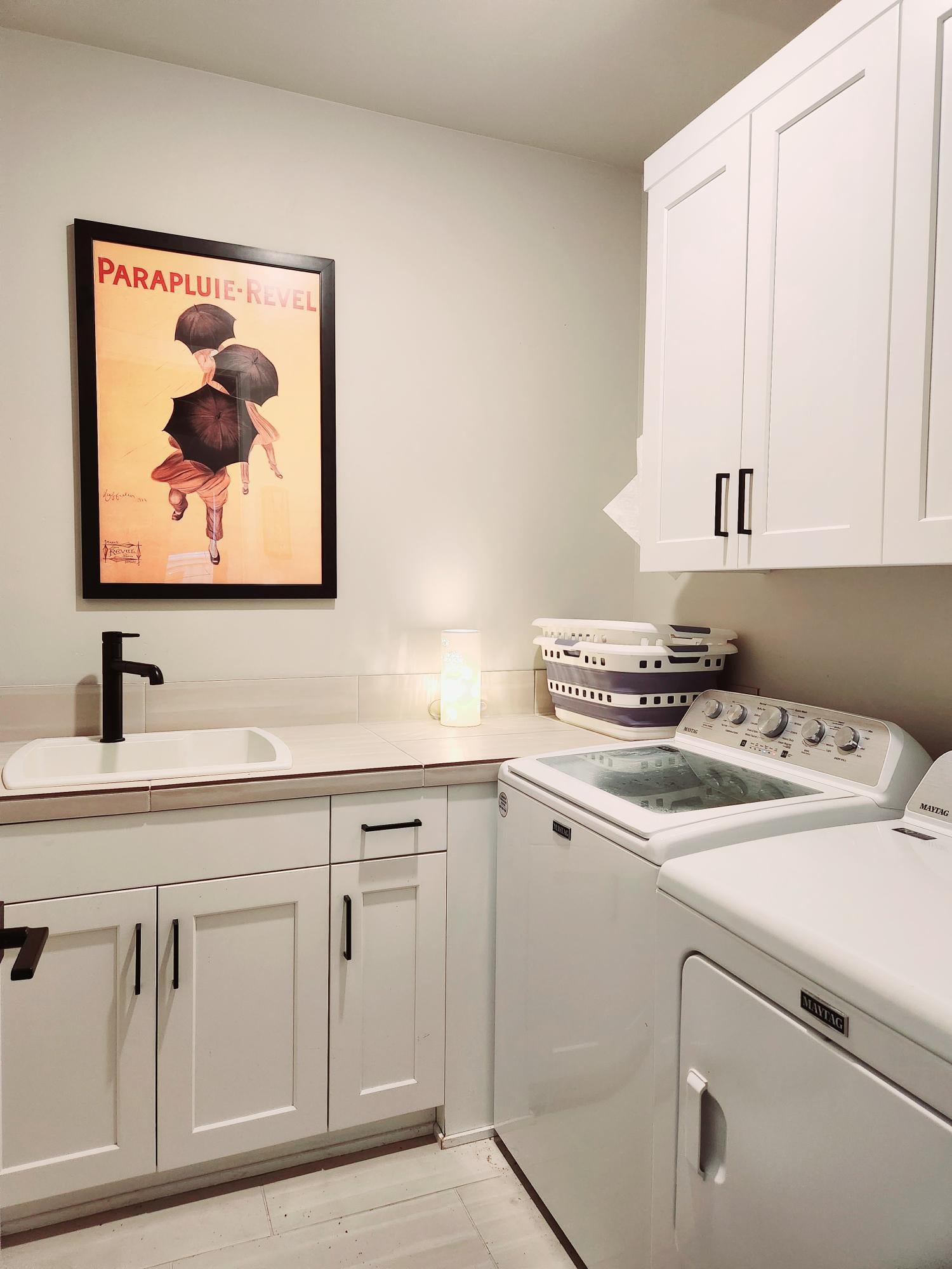 2345 Northwest Skyline Ranch Road Bend, OR 97703 - Photo 16 of 20 Laundry room has lots of storage, sink and tile floor.