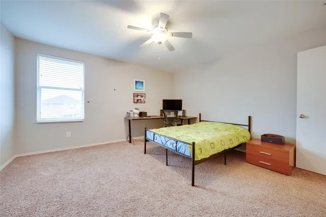 a bedroom with furniture and a chandelier