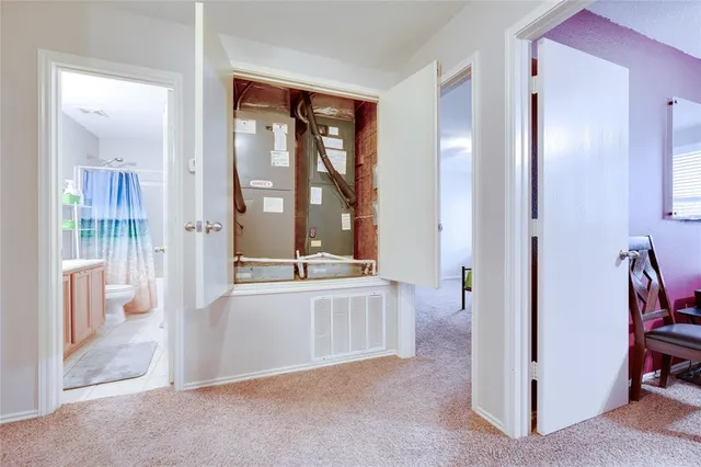 a large en suite bathroom with a granite countertop tub sink and mirror