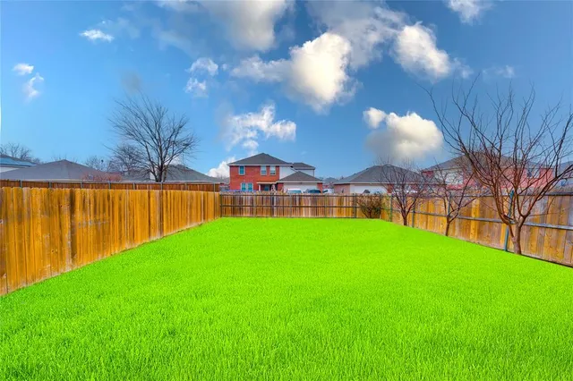 a view of a backyard with a garden