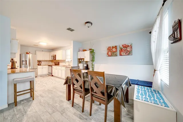 a view of a dining room with furniture