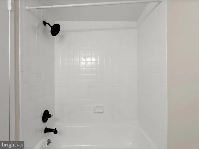 an empty room with closet area