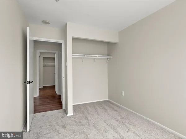 a view of a door and an empty room