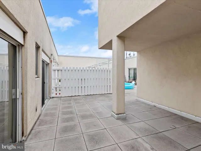 a view of a chairs and table in the patio