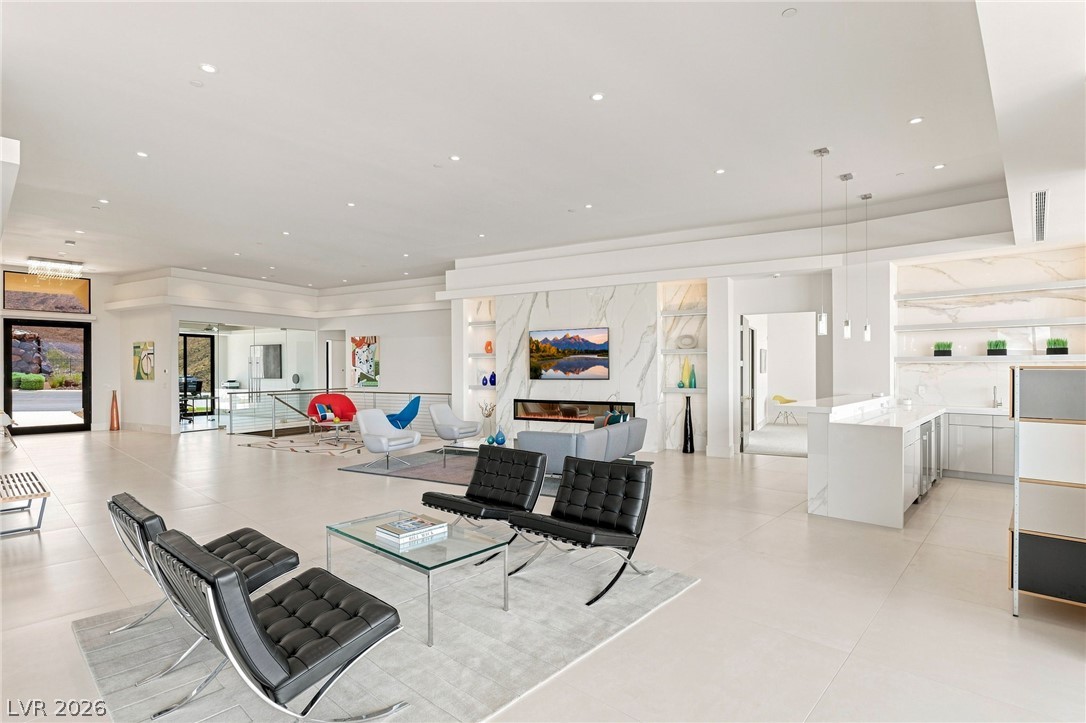 677 Overlook Rim Drive Henderson, NV 89012 - Photo 10 of 97 Polished tile flooring and recessed lighting define this expansive open concept living area.