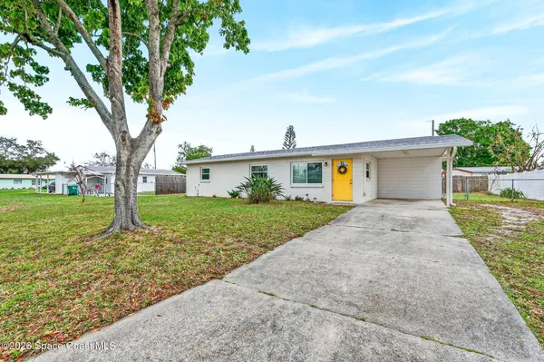front view of a house with a yard