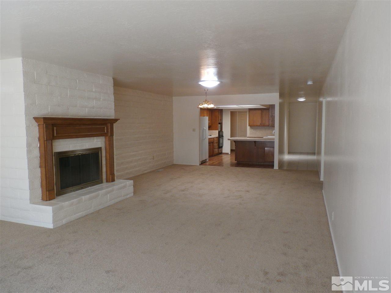 5062 Lakeridge Terrace East Reno, NV 89509 - Photo 4 of 13 a view of an empty room with a fireplace