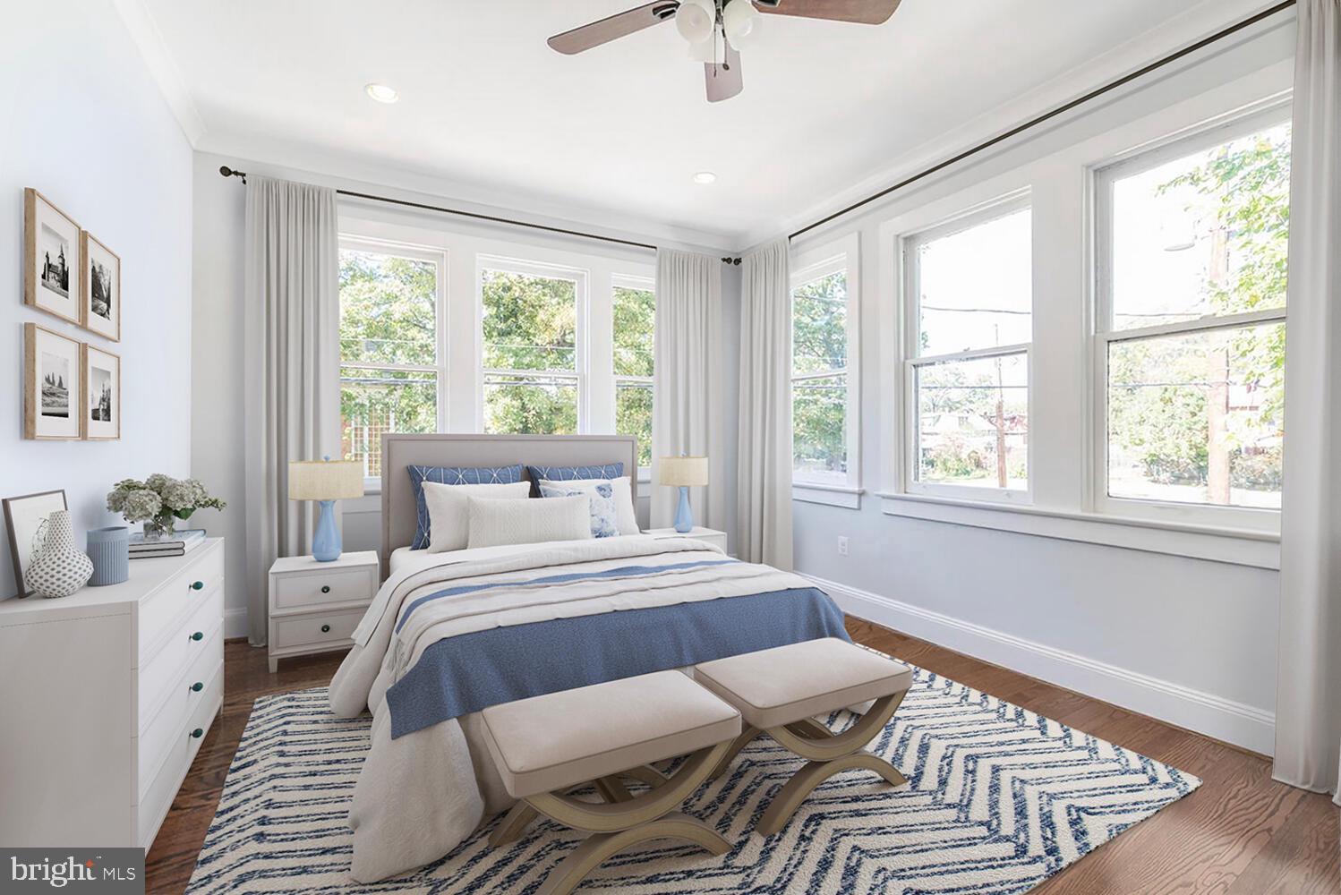 1507 Decatur Street Northwest Washington, DC 20011 - Photo 14 of 30 a bedroom with a bed and wooden floor