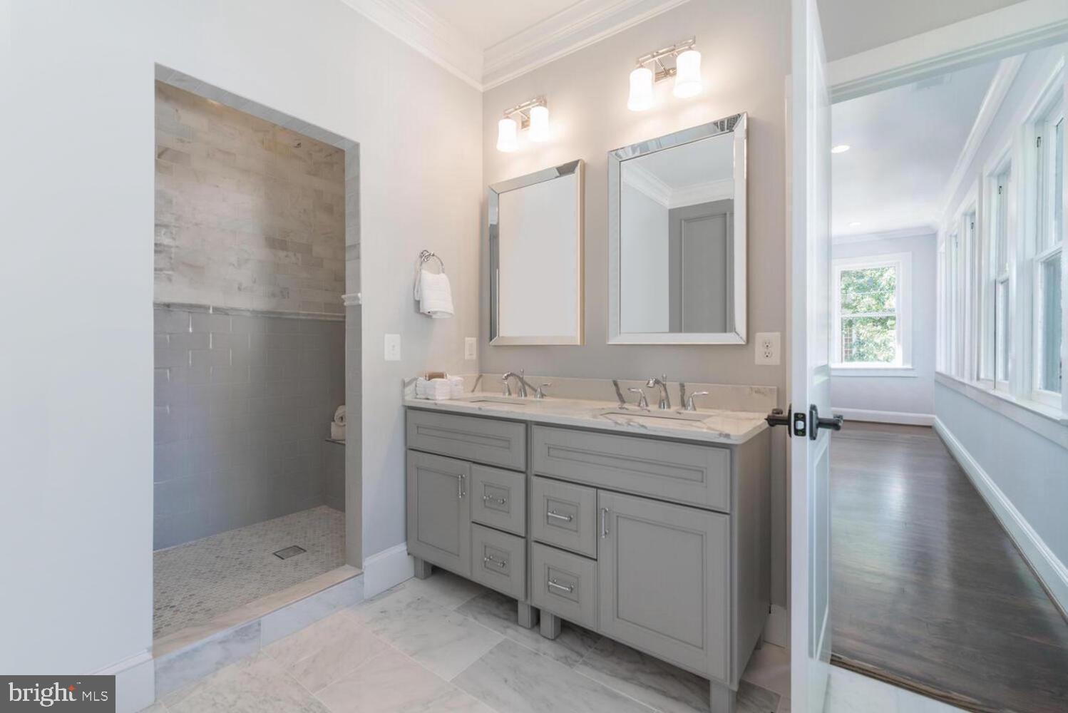 1507 Decatur Street Northwest Washington, DC 20011 - Photo 15 of 30 a bathroom with a double vanity sink and mirror with shower