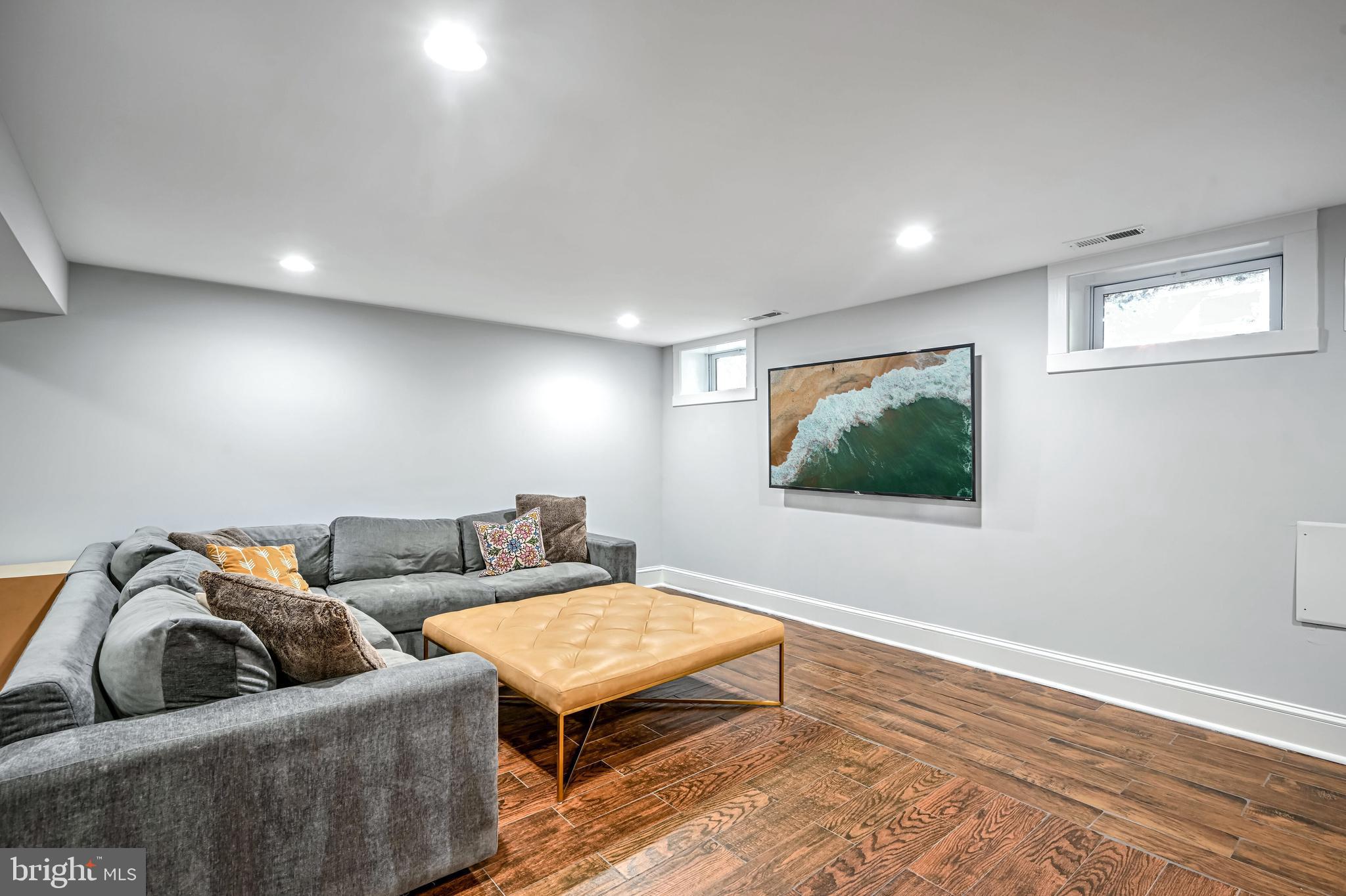 1507 Decatur Street Northwest Washington, DC 20011 - Photo 20 of 30 a living room with furniture and a window
