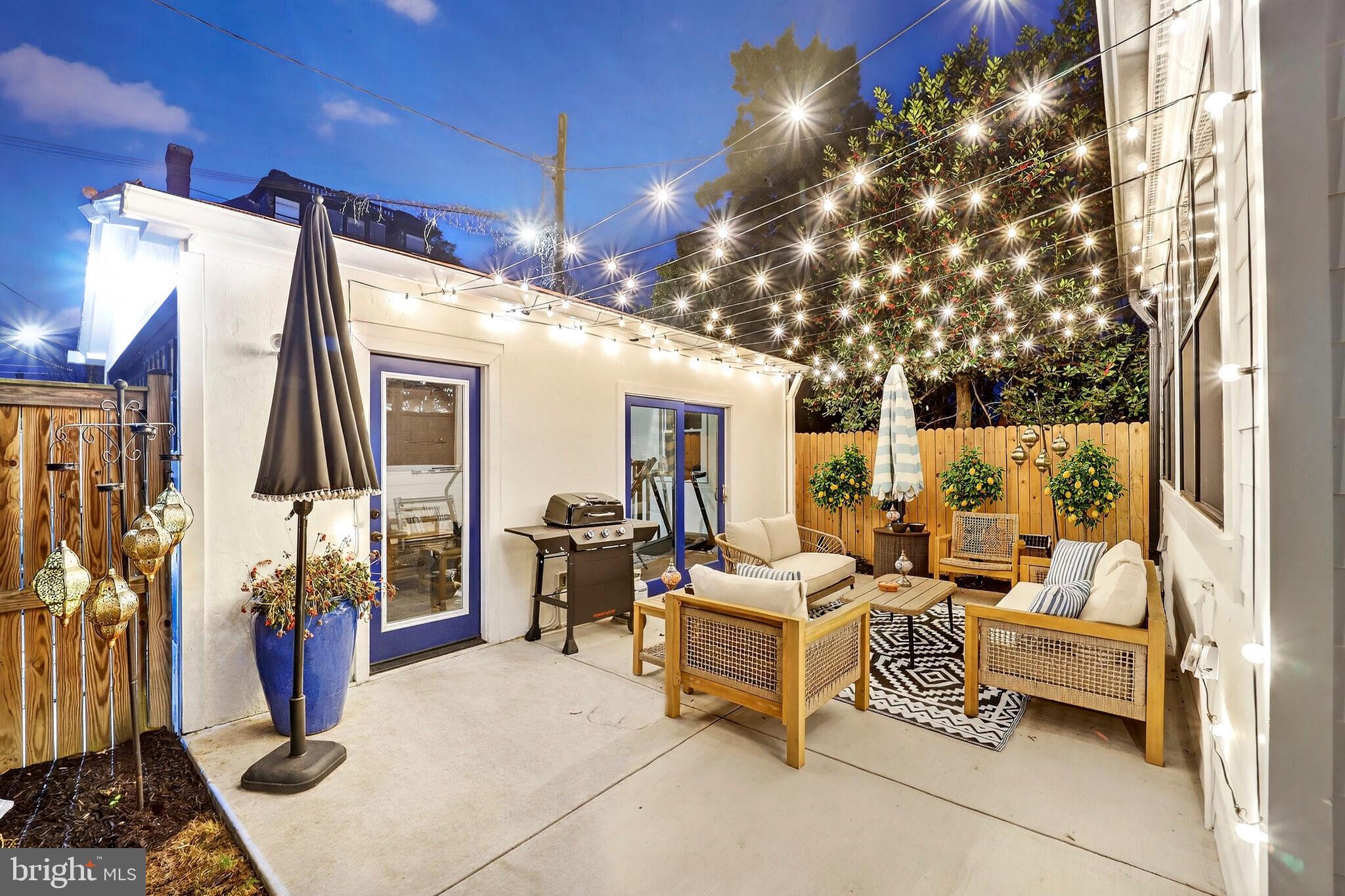1507 Decatur Street Northwest Washington, DC 20011 - Photo 3 of 30 a building outdoor space with patio furniture and potted plants