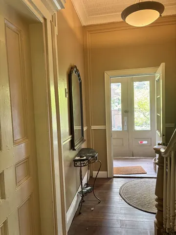 a view of a livingroom with furniture and windows
