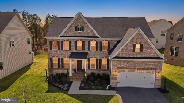 a front view of a house with yard