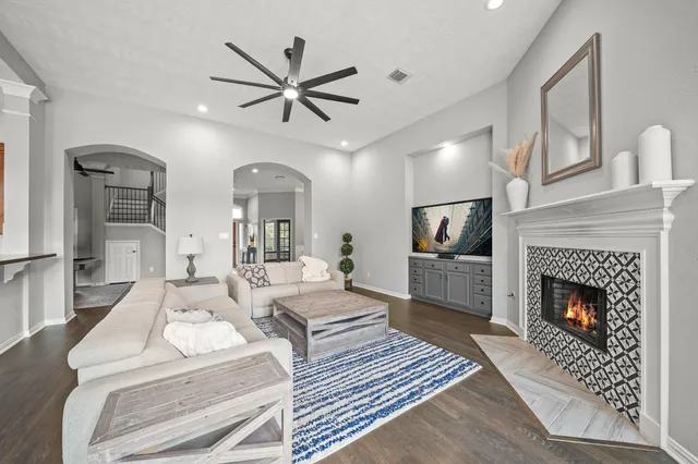 a dining room with furniture water view and a floor to ceiling window