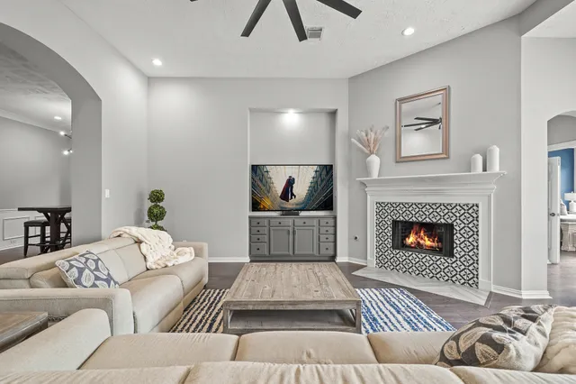 a living room with furniture and a large window