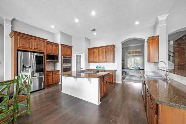a view of a livingroom with furniture and a flat screen tv
