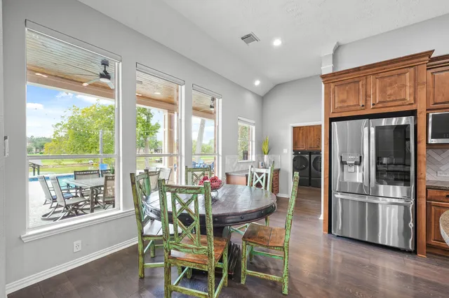 a living room with furniture and a ceiling fan