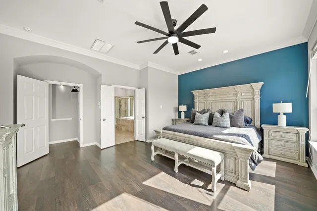 a view of a patio with table and chairs potted plants and large tree