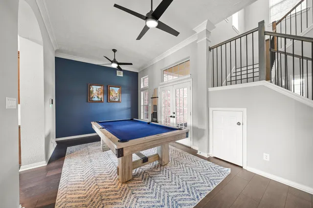 a living room with stainless steel appliances granite countertop lots of counter top space and furniture