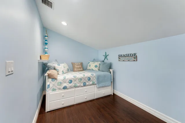 a bedroom with bed and window