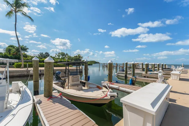 a view of a roof deck with couches table and chairs