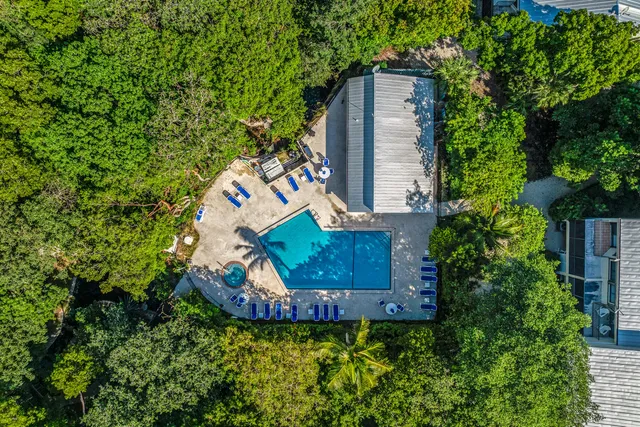 an aerial view of a house with a garden