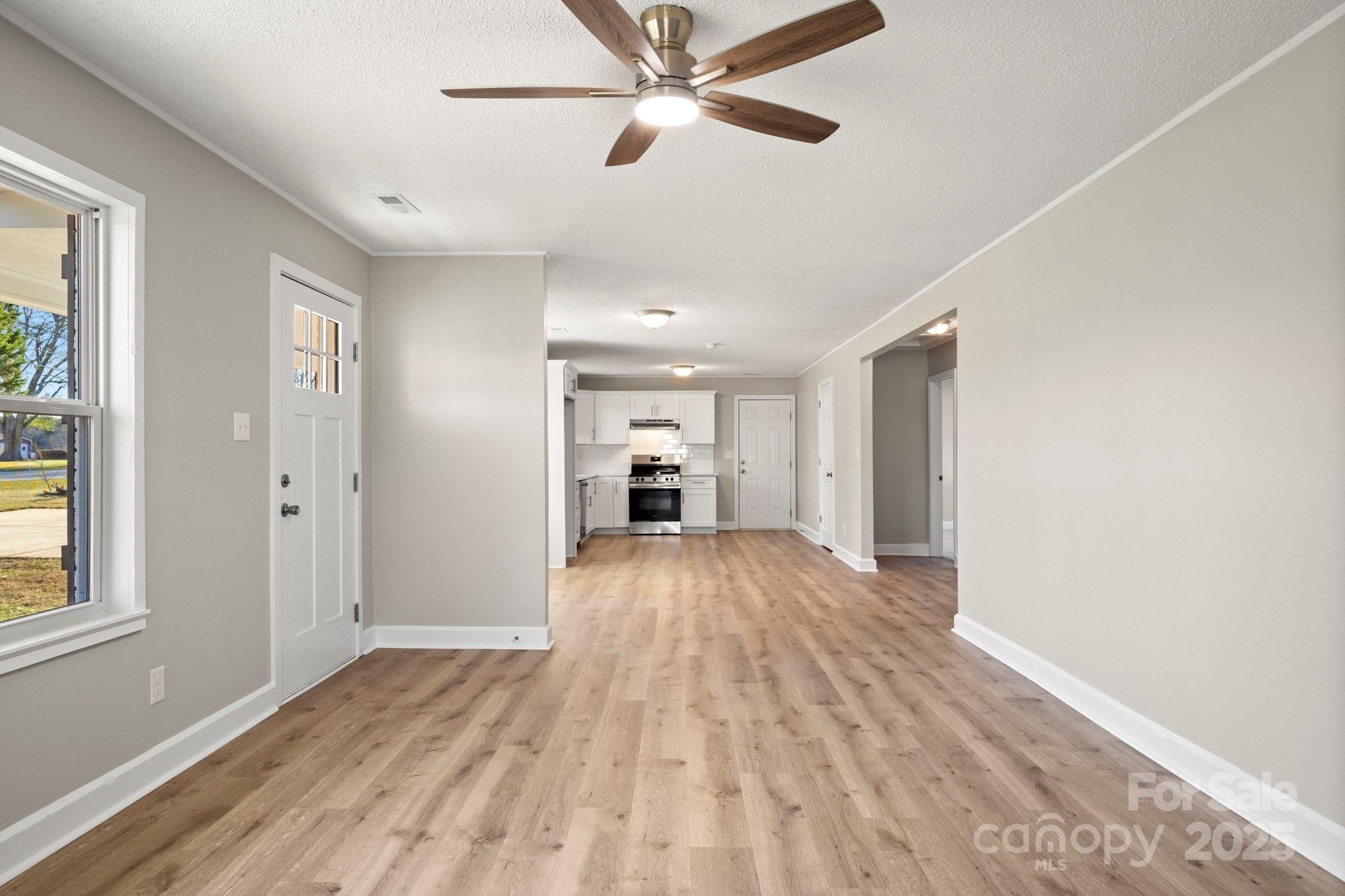 1421 North Post Road Shelby, NC 28150 - Photo 11 of 34 a view of empty room with wooden floor and fan