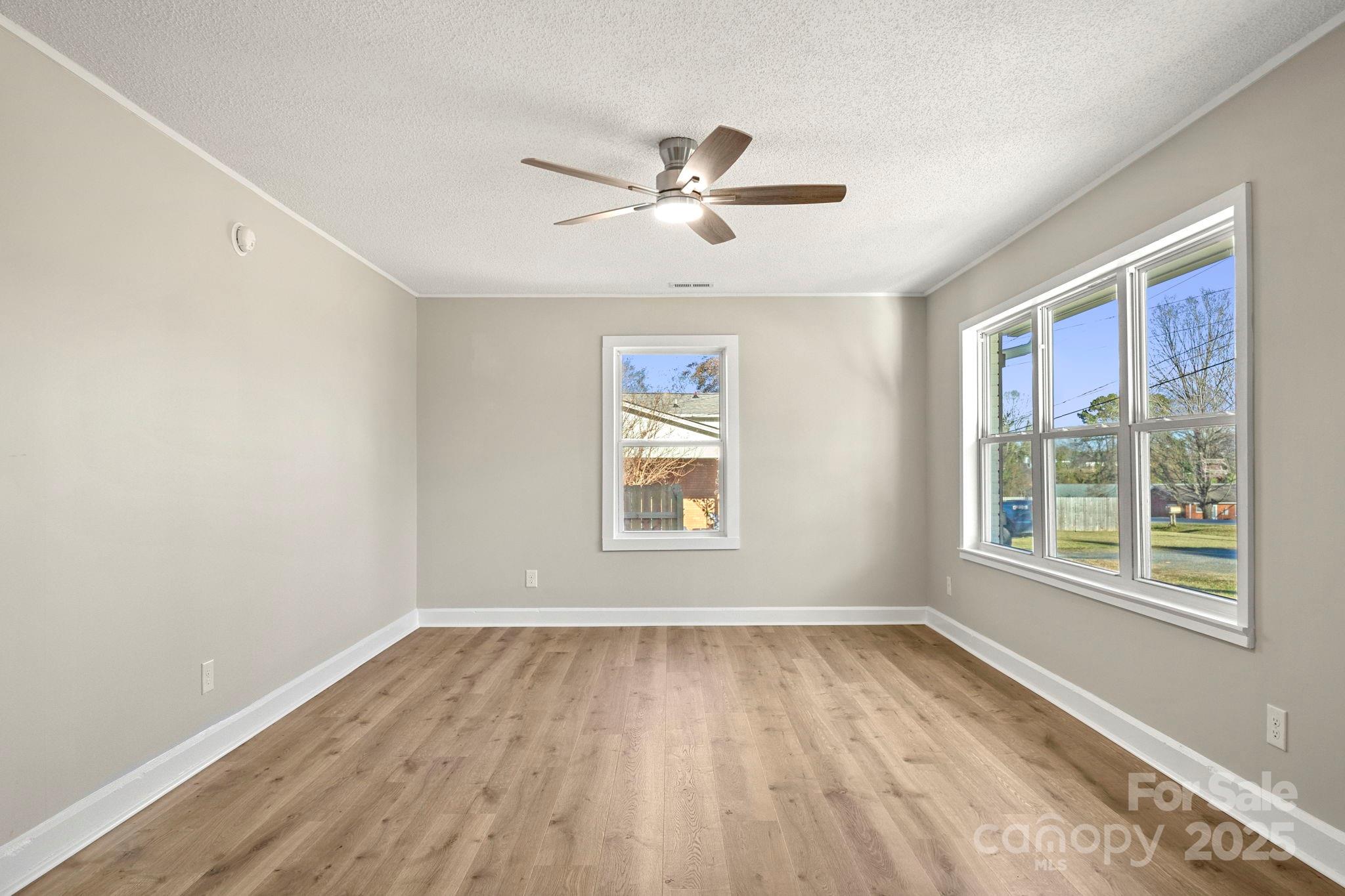 1421 North Post Road Shelby, NC 28150 - Photo 12 of 34 wooden floor in an empty room with a window