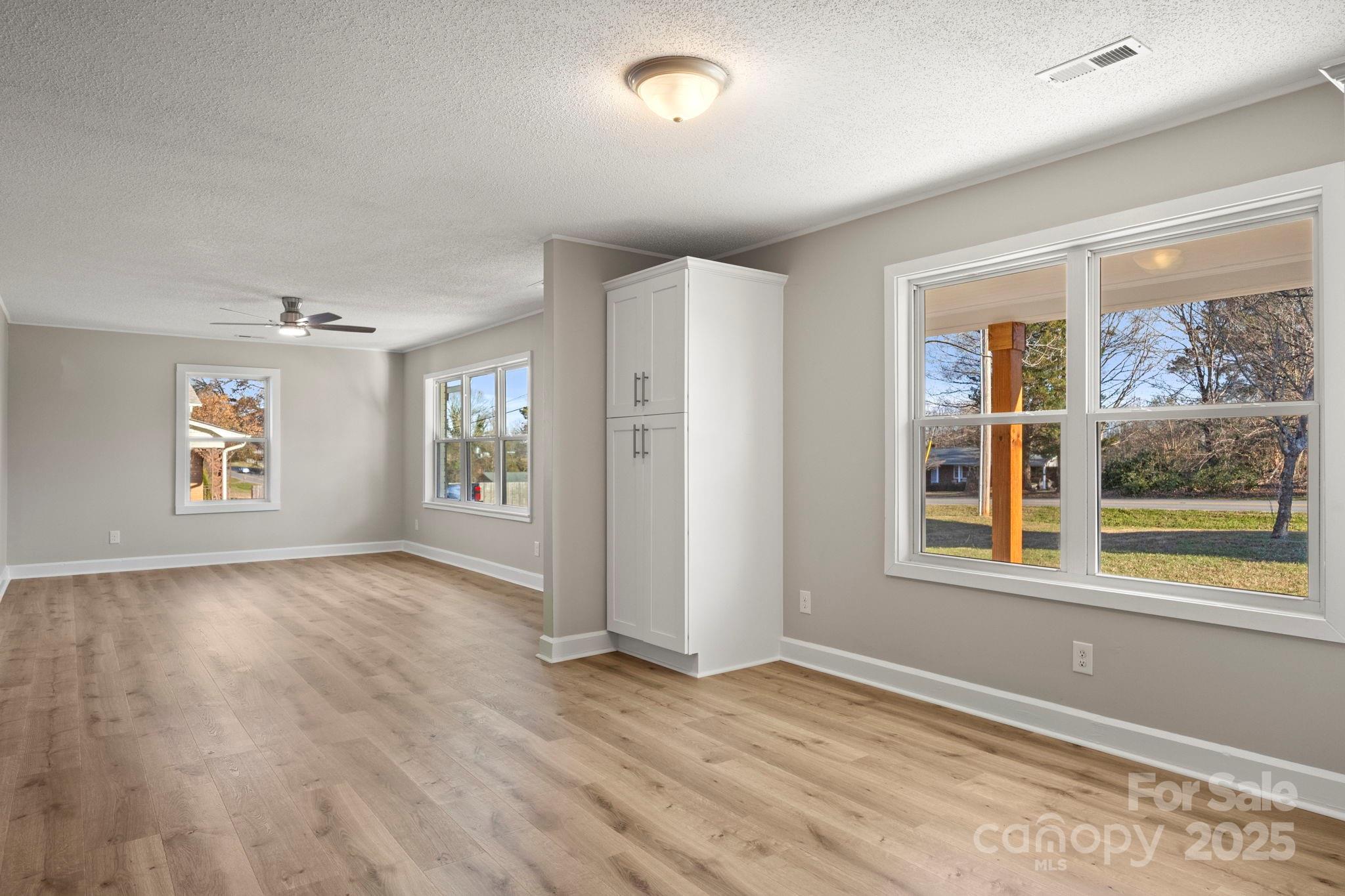 1421 North Post Road Shelby, NC 28150 - Photo 15 of 34 wooden floor in an empty room with a window