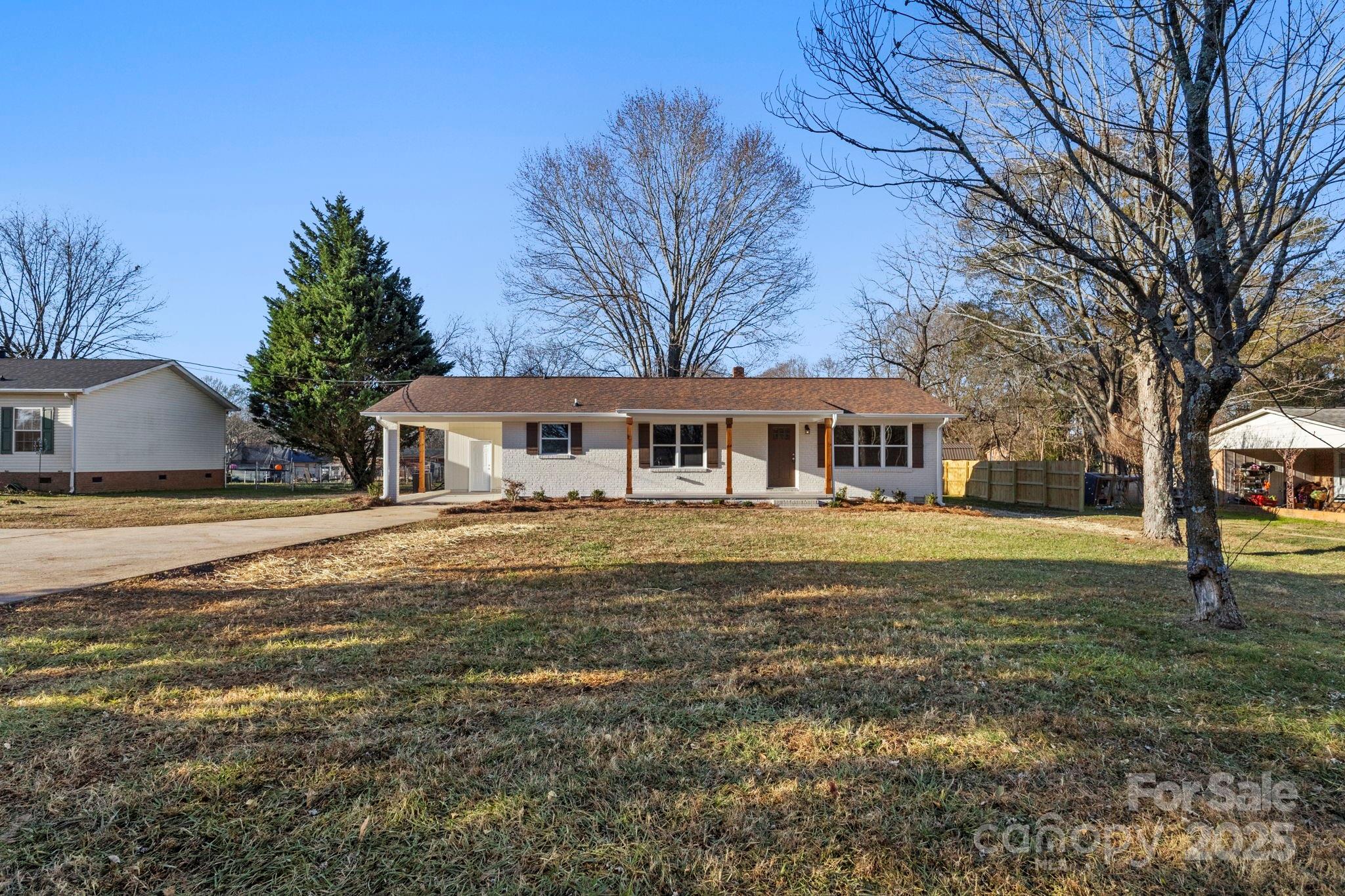 1421 North Post Road Shelby, NC 28150 - Photo 2 of 34 a front view of a house with a garden