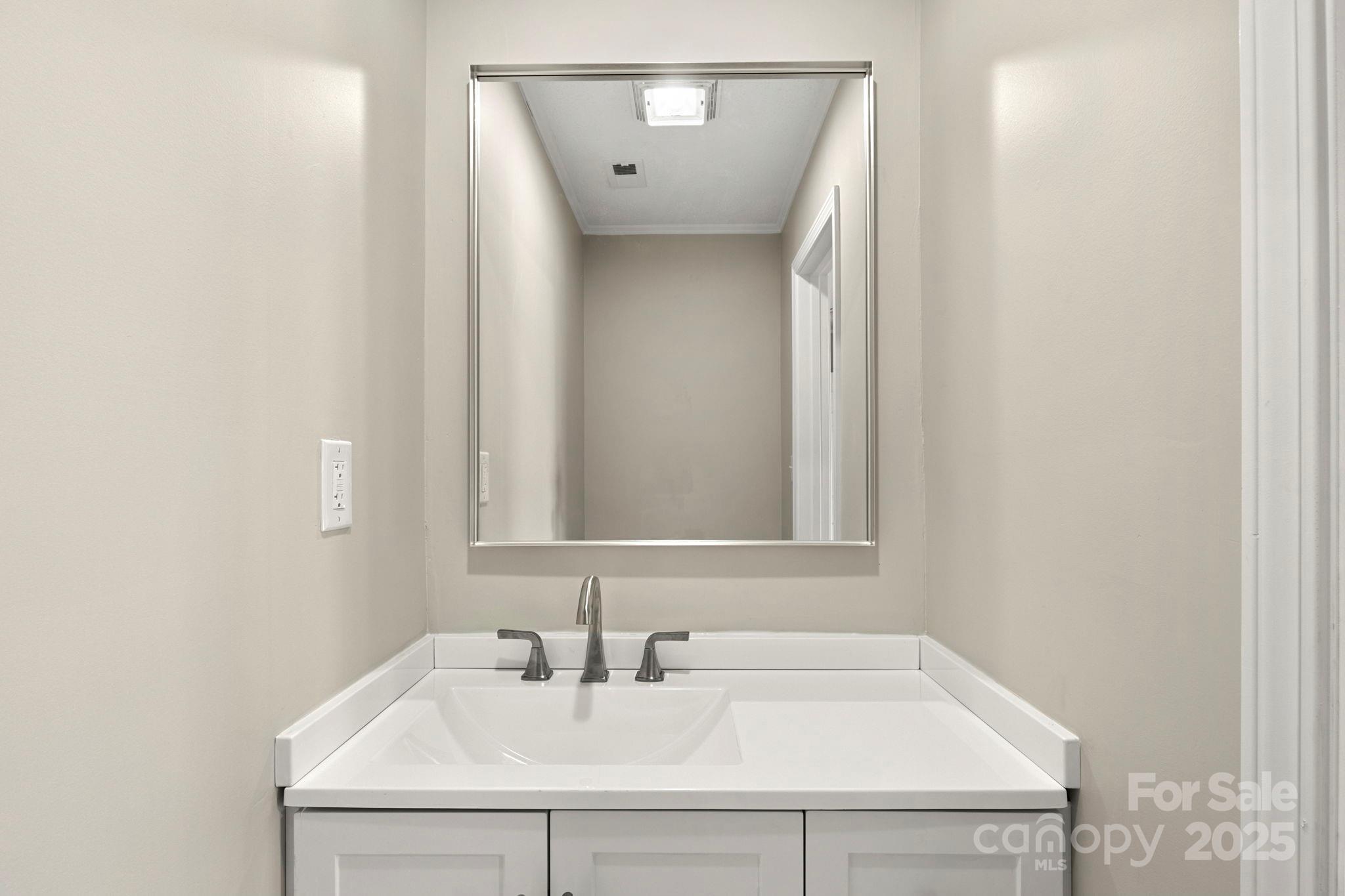 1421 North Post Road Shelby, NC 28150 - Photo 25 of 34 a bathroom with a sink and a mirror