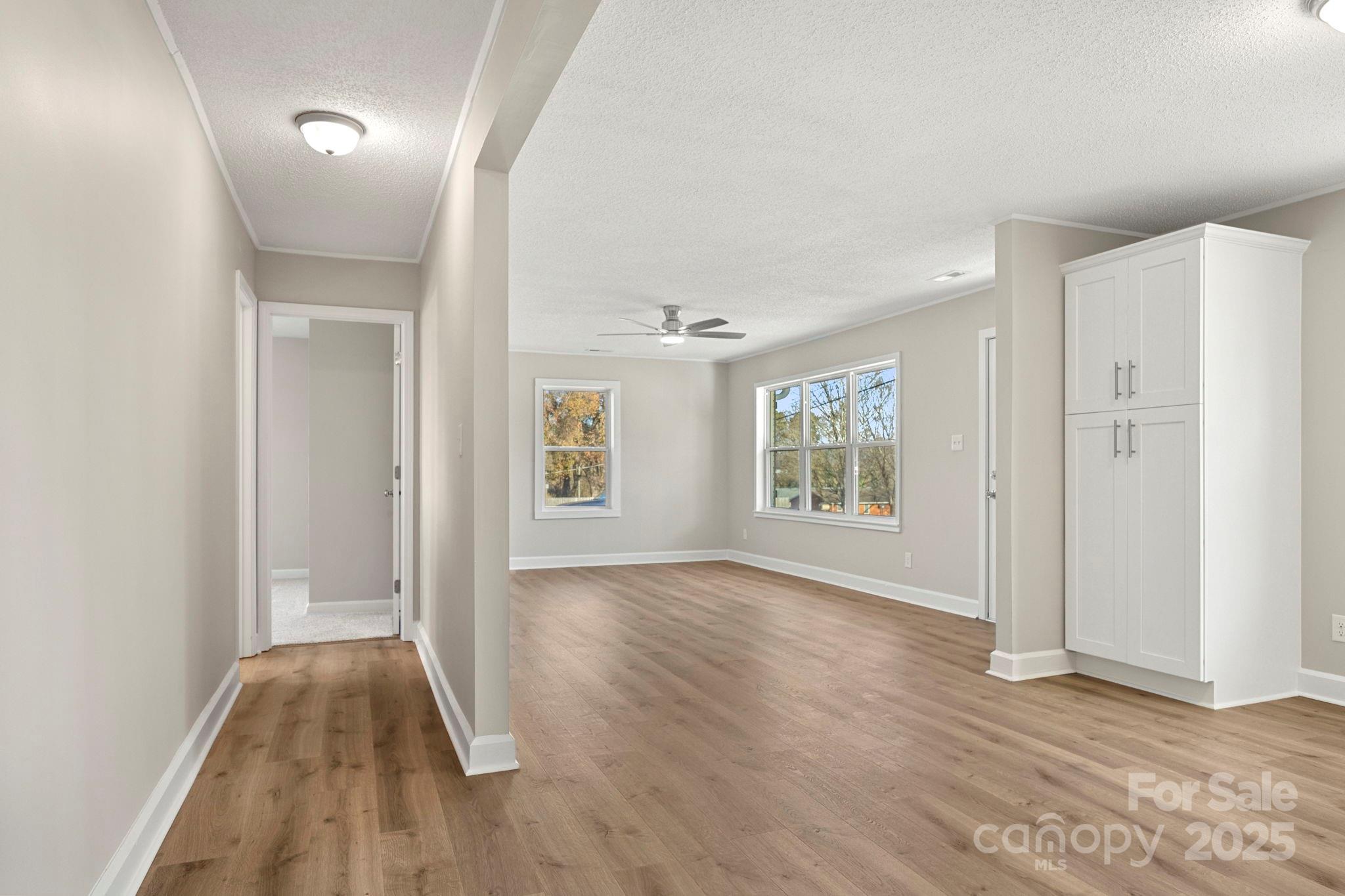 1421 North Post Road Shelby, NC 28150 - Photo 26 of 34 an empty room with wooden floor and windows