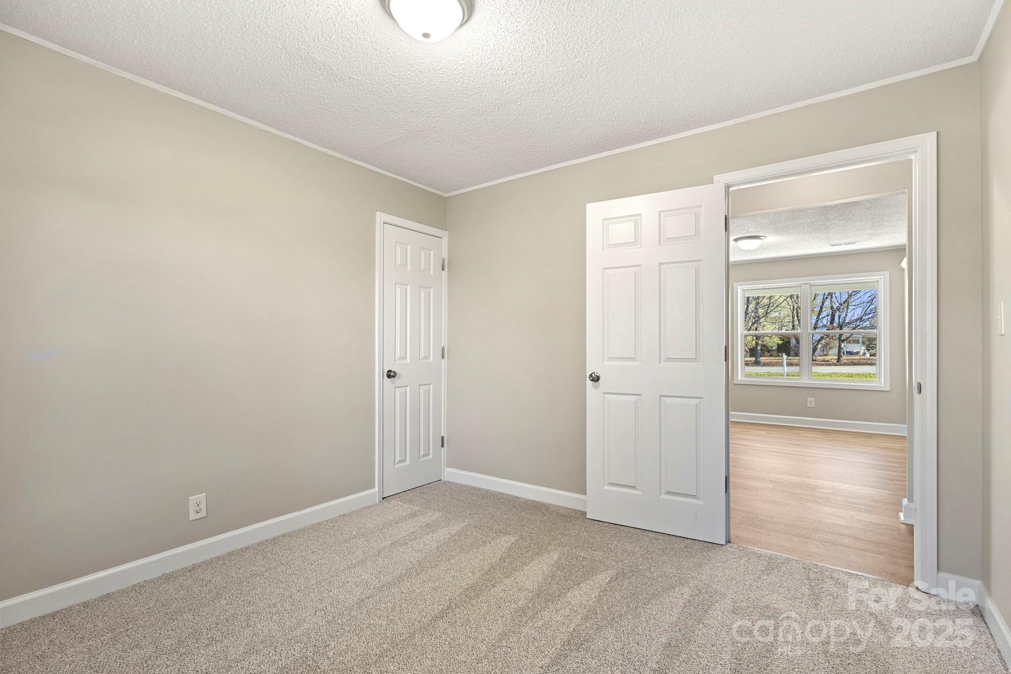 1421 North Post Road Shelby, NC 28150 - Photo 27 of 34 an empty room with windows and closet