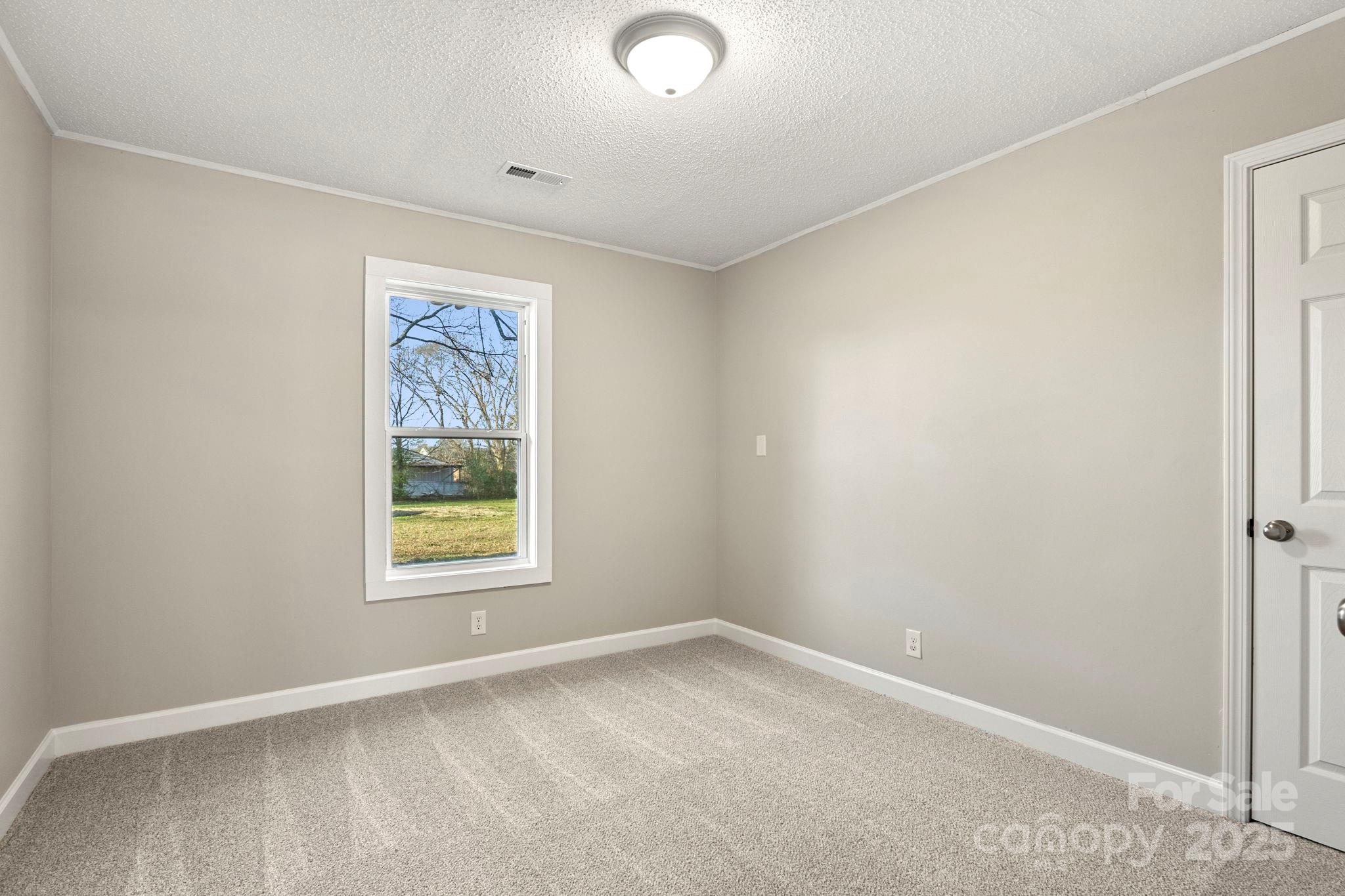 1421 North Post Road Shelby, NC 28150 - Photo 28 of 34 an empty room with a window
