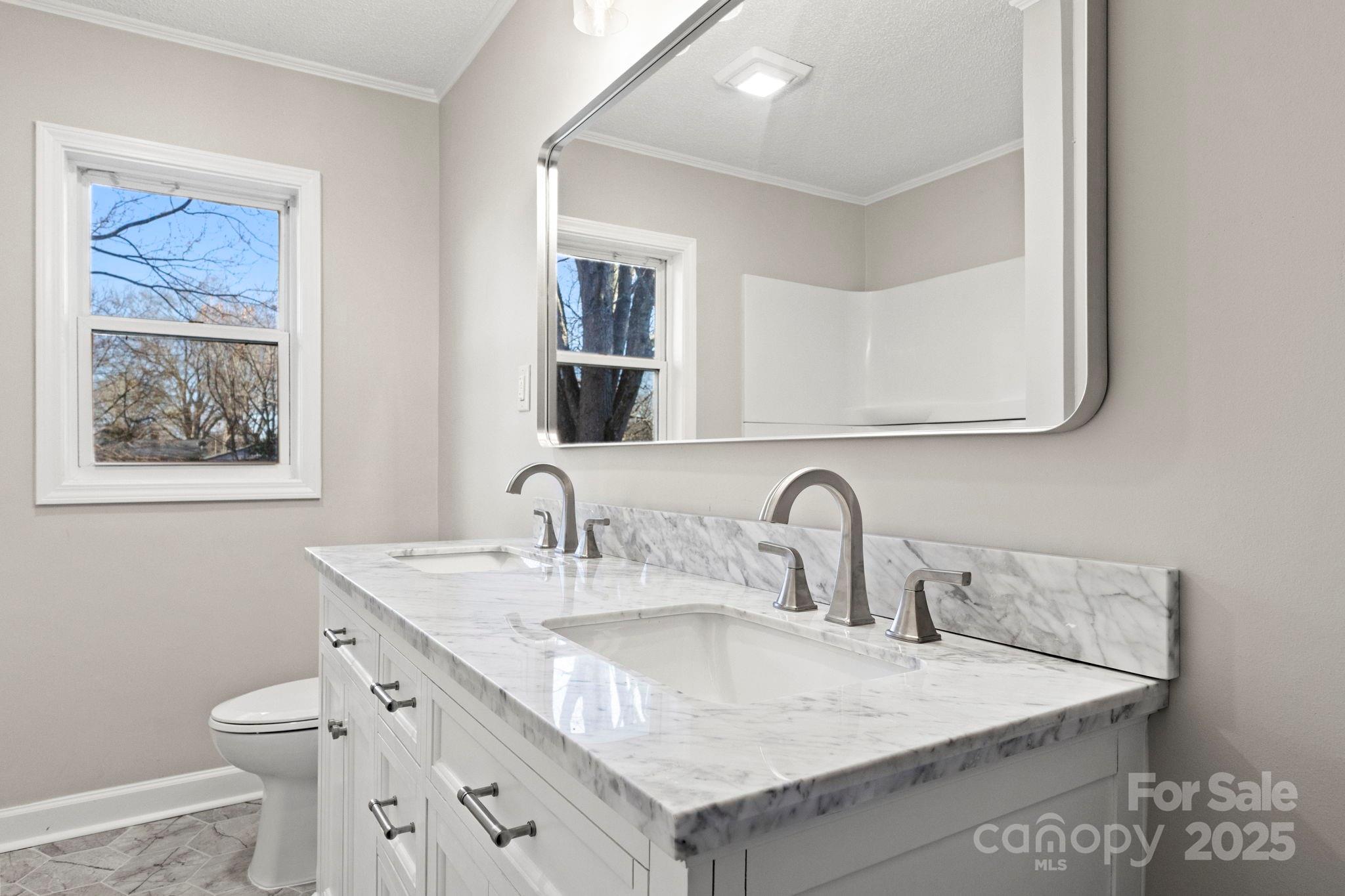 1421 North Post Road Shelby, NC 28150 - Photo 29 of 34 a close view of a sink and a toilet in a bathroom
