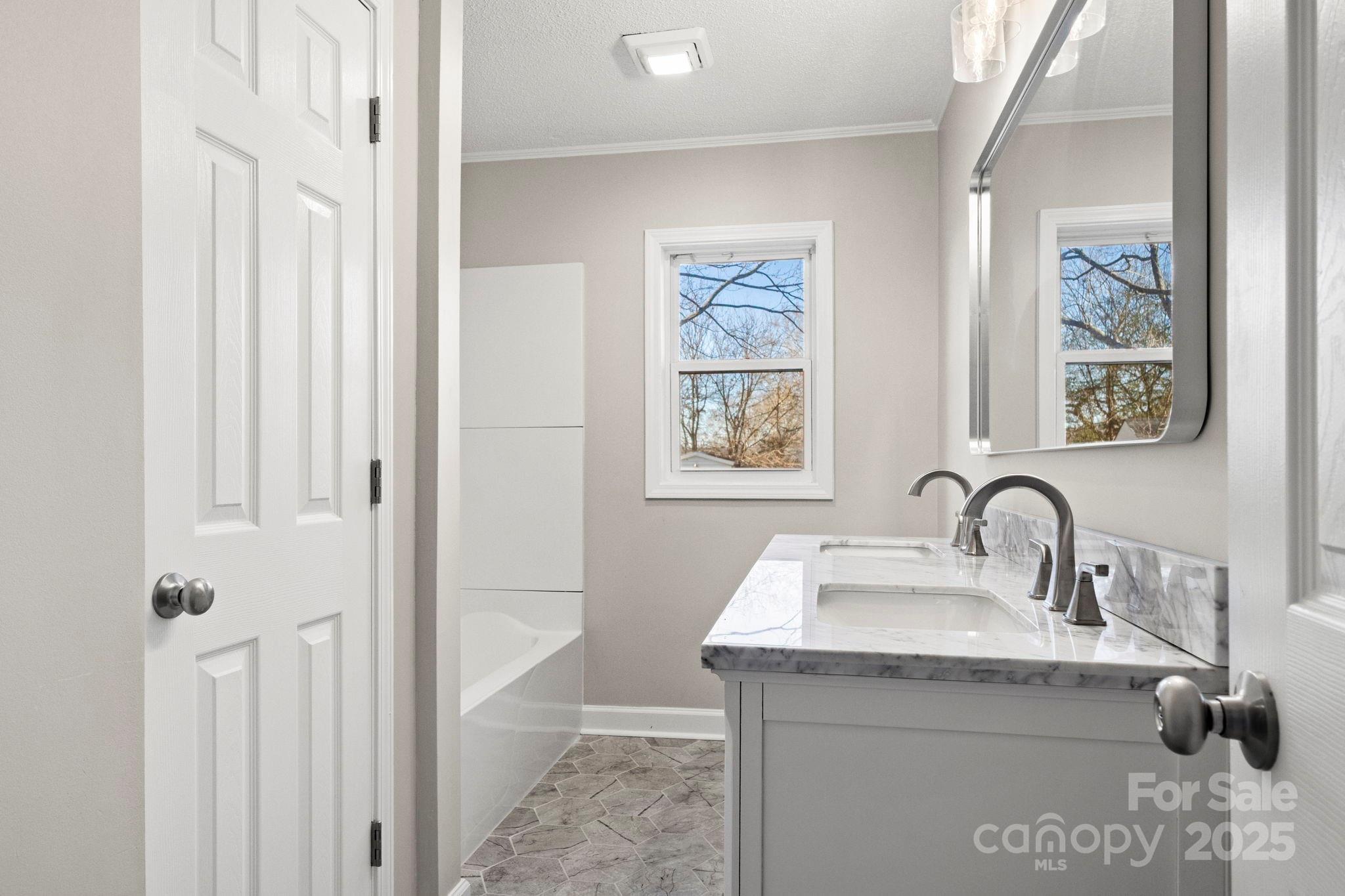 1421 North Post Road Shelby, NC 28150 - Photo 30 of 34 a bathroom with a sink and a mirror
