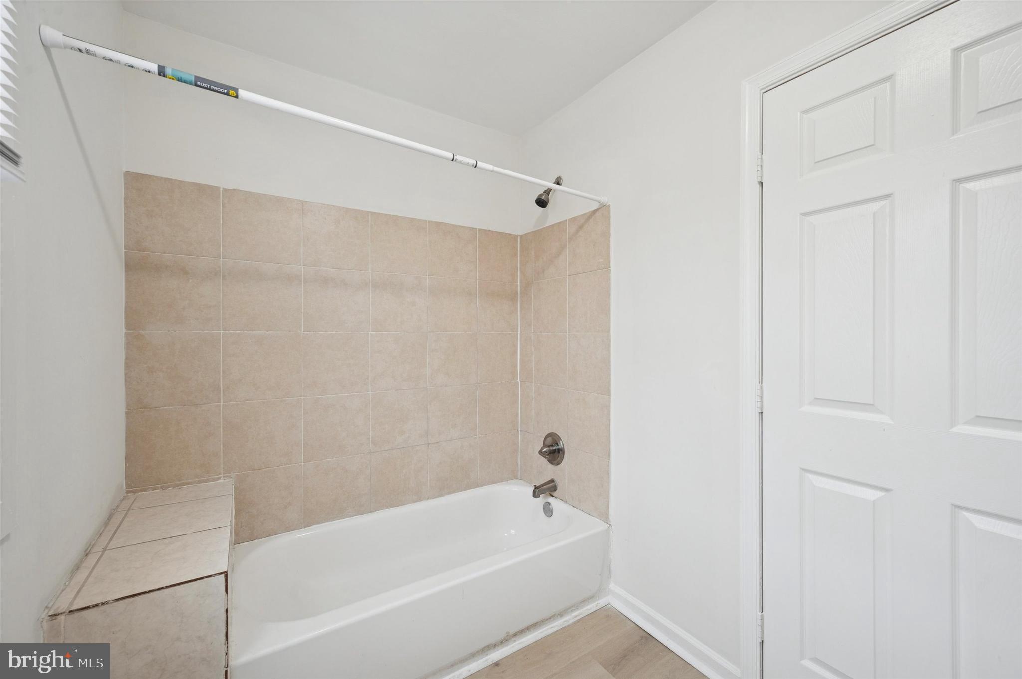 2457 North Patton Street Philadelphia, PA 19132 - Photo 21 of 23 a bathroom with a bathtub and a shower