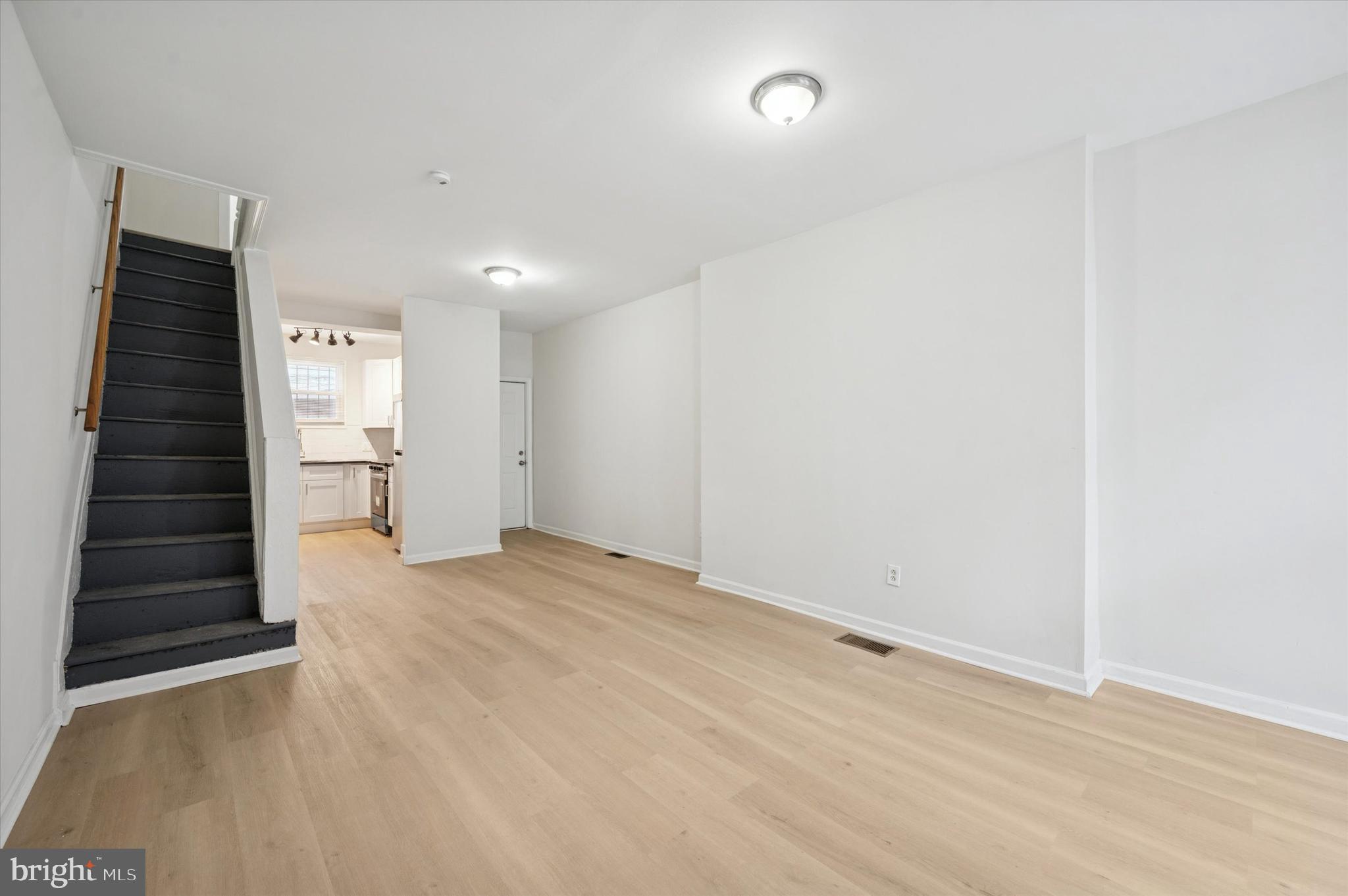 2457 North Patton Street Philadelphia, PA 19132 - Photo 6 of 23 a view of an empty room with a fireplace