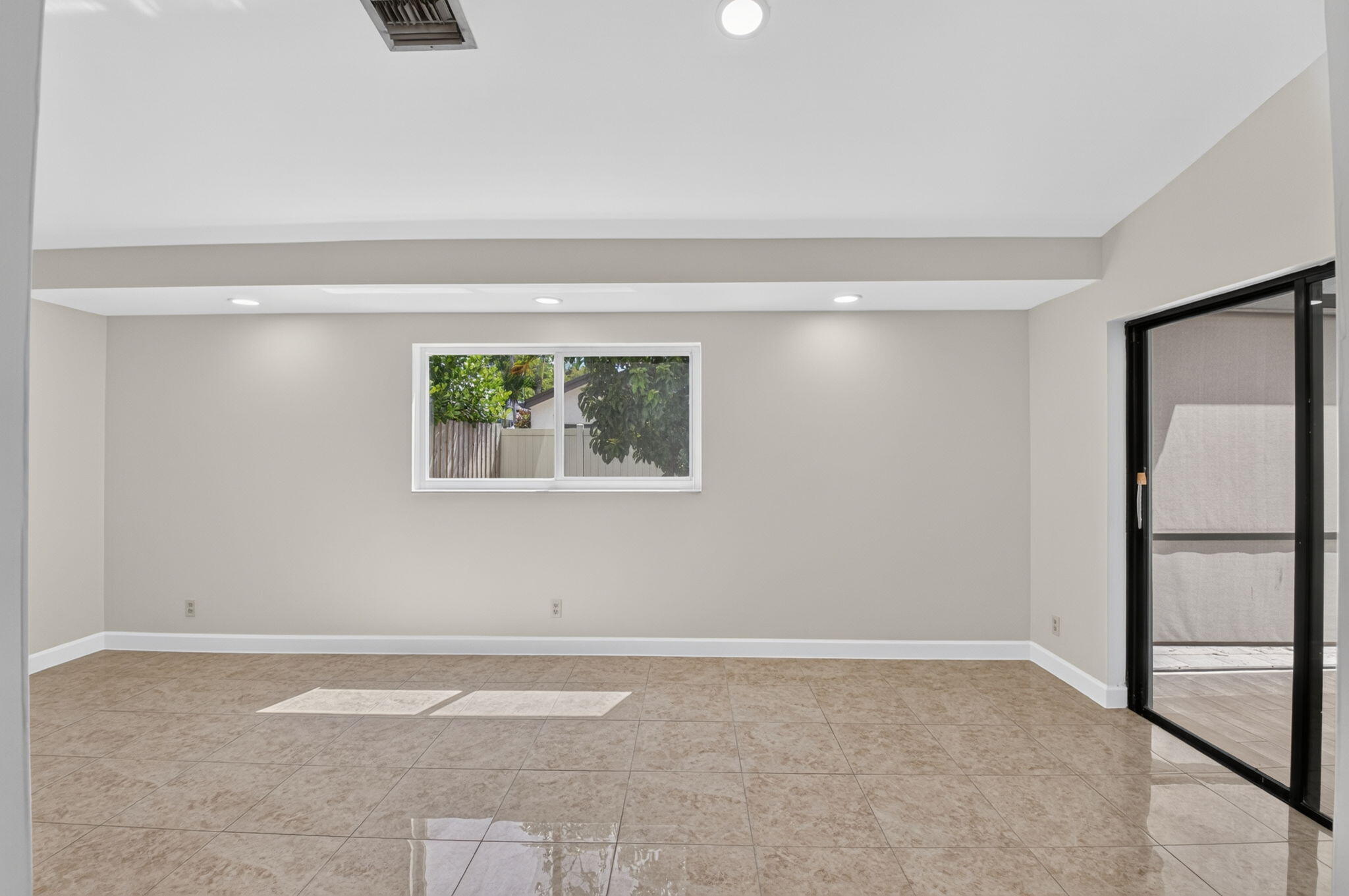21070 Woodspring Avenue Boca Raton, FL 33428 - Photo 11 of 30 a view of an empty room with a window