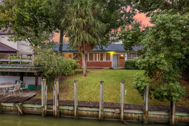 a house view with a sitting space and a swimming pool